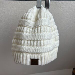 C.C EXCLUSIVES White Knit Cable Rows Beanie. 100% White Acrylic.